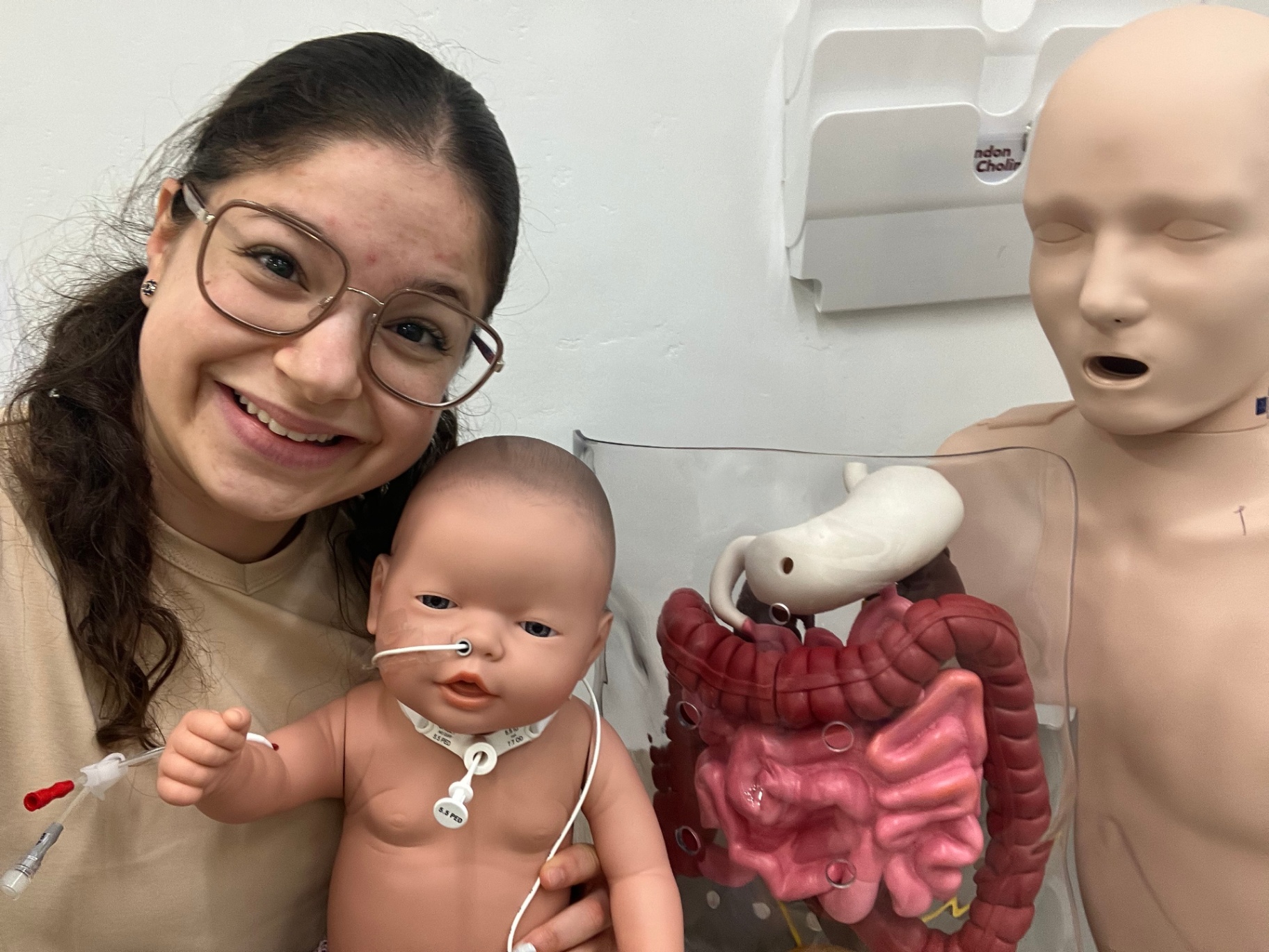 A carer at Care Shouldn't Hurt training with an infant model