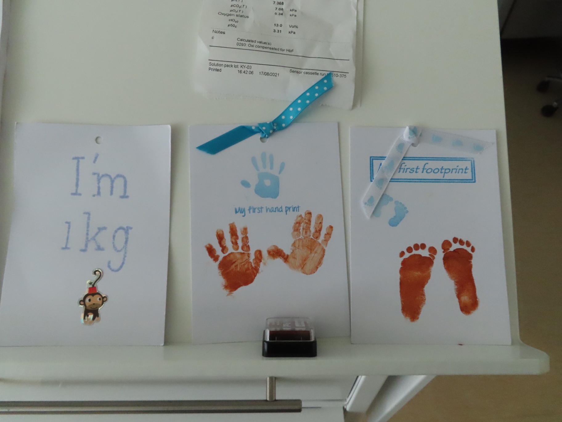 Baby memory cards with tiny hand and footprints from NICU